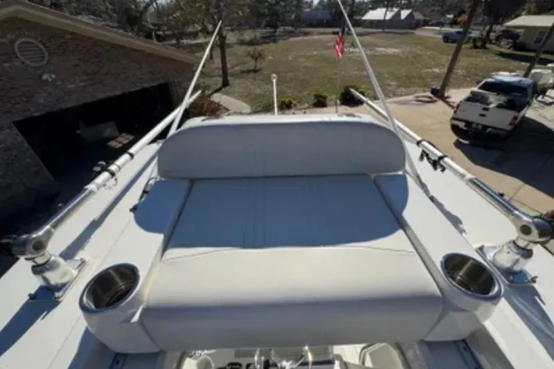 Slide: The Image of 2019 SeaVee 320B boat with cushioned seating and rod holders on deck. - 17