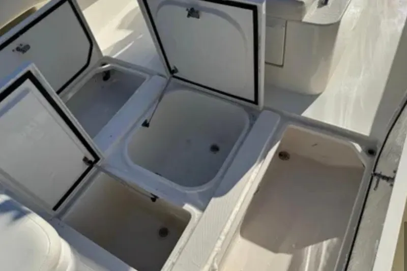Slide: The Image of Open storage compartments on a 2019 SeaVee 320B boat deck. - 20