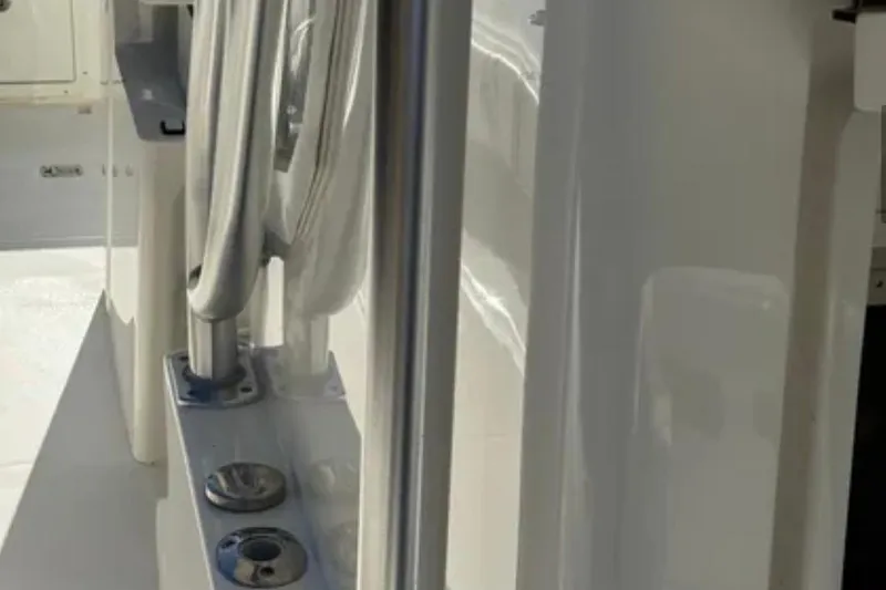 Slide: The Image of 2019 SeaVee 320B boat interior with rod holders and sleek white finish. - 23