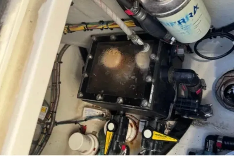 Slide: The Image of Engine compartment of a 2019 SeaVee 320B boat, showing fuel and filter systems. - 24