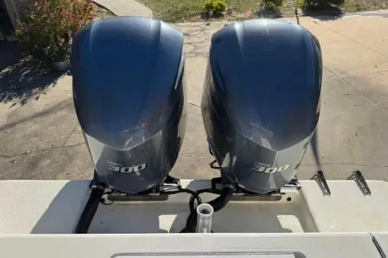 Slide: The Image of Twin 300 horsepower engines on a 2019 SeaVee 320B boat, viewed from above. - 27