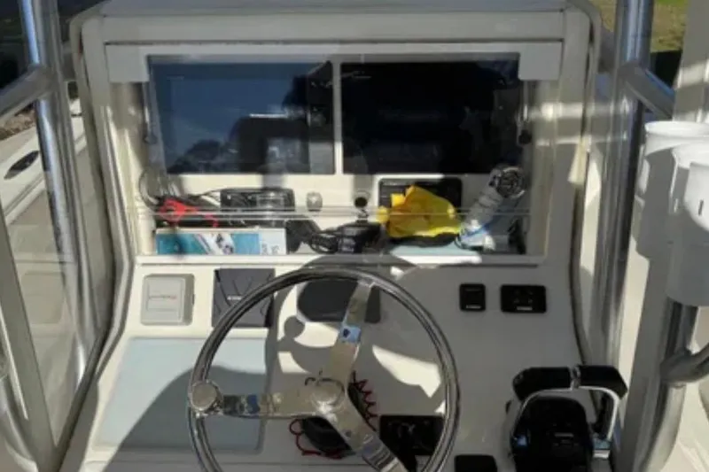 Slide: The Image of 2019 SeaVee 320B boat dashboard with steering wheel and control panel. - 8