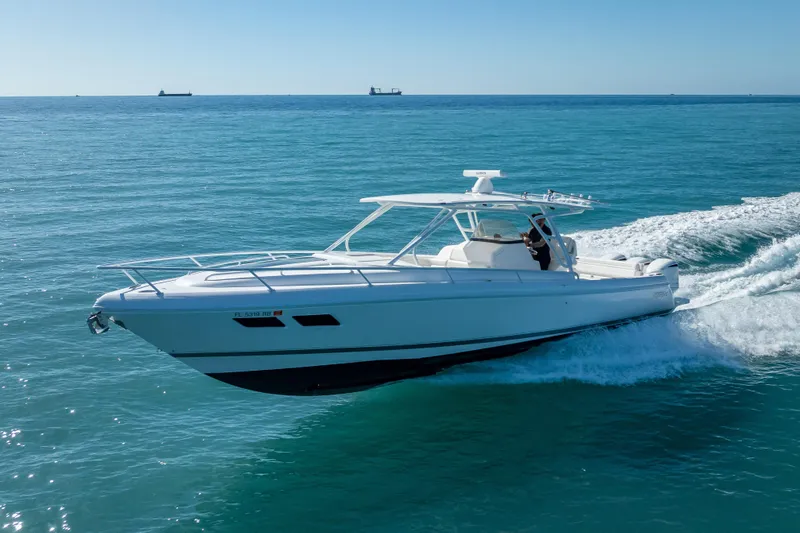 Slide: The Image of 2016 Intrepid 375 Center Console cruising on open blue water. - 18