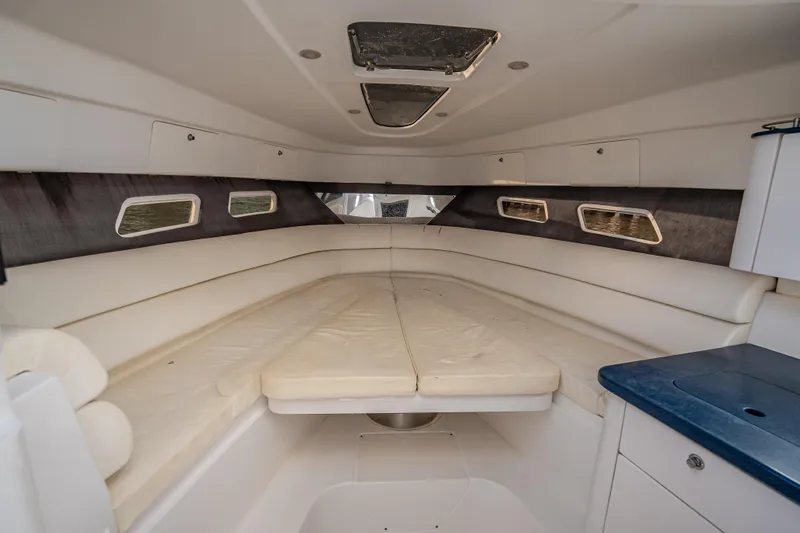 Slide: The Image of Interior cabin of 2016 Intrepid 375 Center Console with white seating and windows. - 23