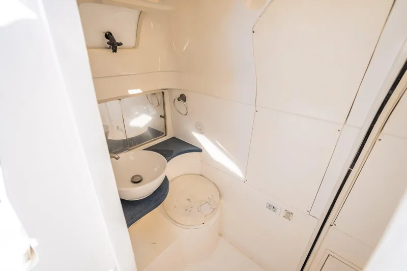 Slide: The Image of 2016 Intrepid 375 Center Console boat bathroom interior with sink and mirror. - 28