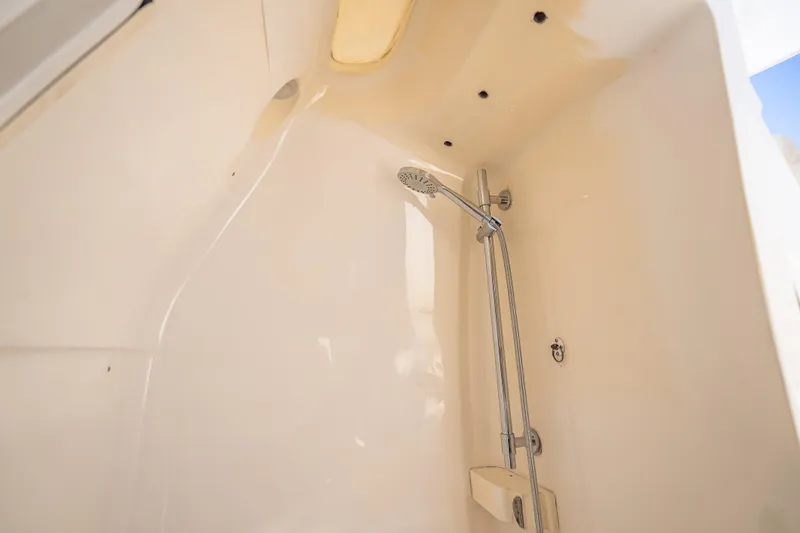 Slide: The Image of Shower area inside 2016 Intrepid 375 Center Console boat, featuring modern fixtures. - 30