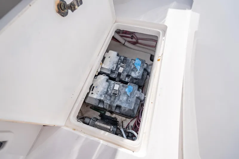 Slide: The Image of Battery compartment of a 2016 Intrepid 375 Center Console boat, showing two batteries. - 31
