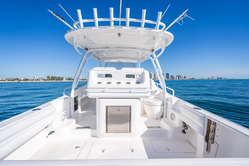 Slide: The Image of 2016 Intrepid 375 Center Console boat on clear blue ocean with city skyline. - 35