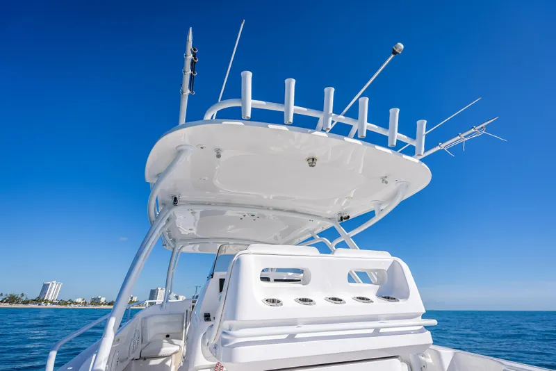 Slide: The Image of 2016 Intrepid 375 Center Console boat against clear blue sky and ocean backdrop. - 37