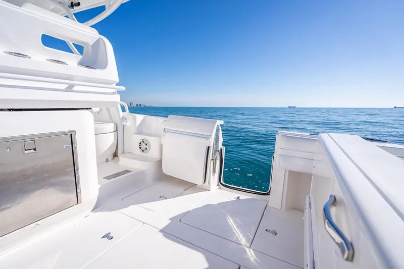 Slide: The Image of 2016 Intrepid 375 Center Console boat interior with ocean view and clear blue sky. - 39