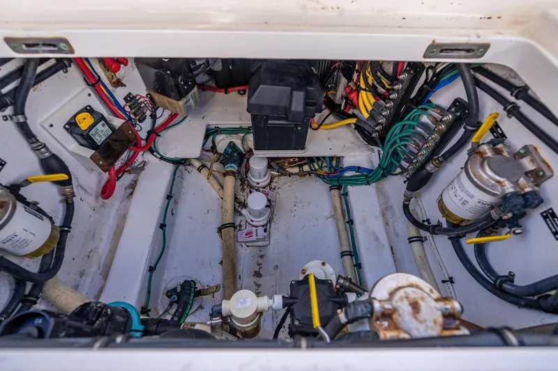 Slide: The Image of Engine compartment of a 2016 Intrepid 375 Center Console, showcasing wiring and components. - 45