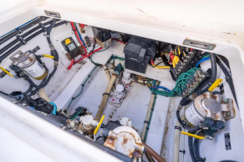 Slide: The Image of Engine compartment of a 2016 Intrepid 375 Center Console, showcasing wiring and components. - 47