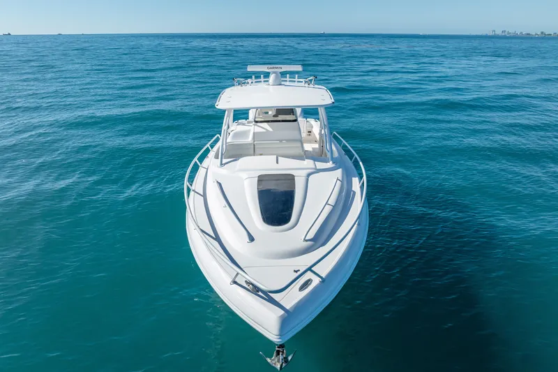 Slide: The Image of 2016 Intrepid 375 Center Console boat on open blue sea, front view. - 5