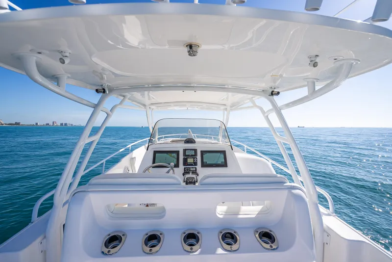 Slide: The Image of 2016 Intrepid 375 Center Console boat on open sea, clear blue sky. - 52