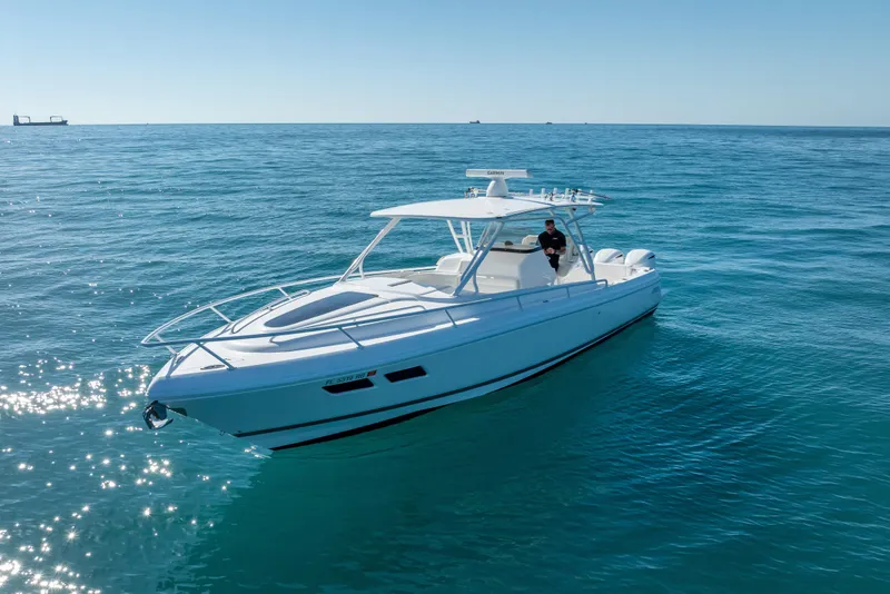 Slide: The Image of 2016 Intrepid 375 Center Console boat on calm blue ocean waters. - 6
