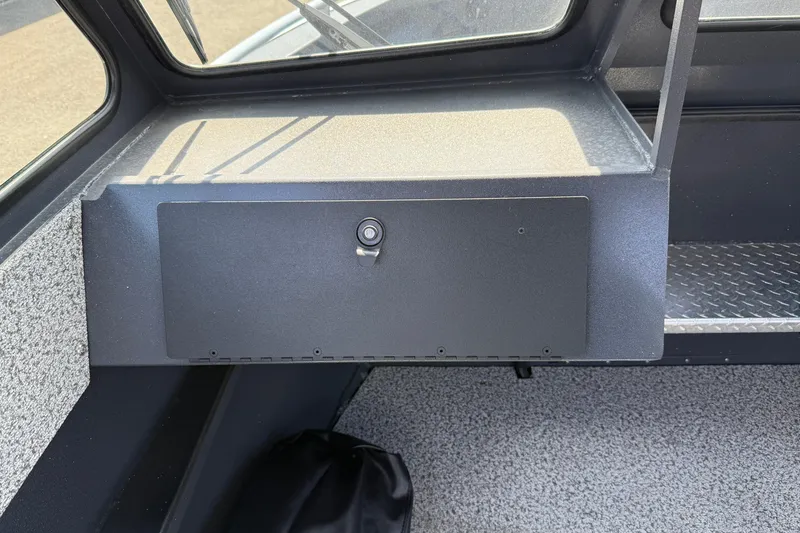 Slide: The Image of 2026 Alumaweld Intruder 22 boat interior with lockable storage compartment. - 10