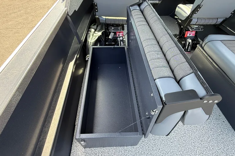 Slide: The Image of 2026 Alumaweld Intruder 22 boat interior with open storage compartment and seating. - 14