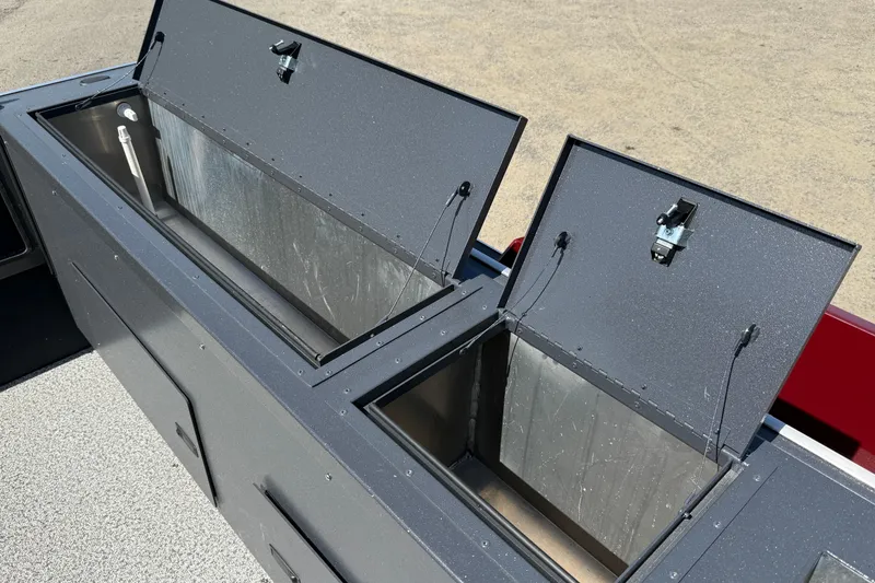 Slide: The Image of Open storage compartments on a 2026 Alumaweld Intruder 22 boat. - 19