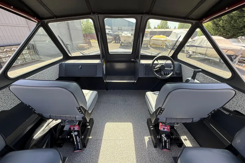 Slide: The Image of Interior of 2026 Alumaweld Intruder 22 boat with dual seats and steering wheel. - 5