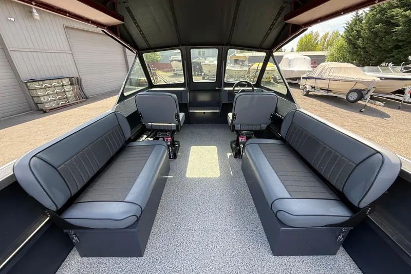 Slide: The Image of Interior of 2026 Alumaweld Intruder 22 boat with seating and steering wheel. - 6