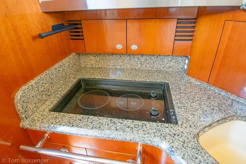 Slide: The Image of Granite countertop with built-in stove on 2005 Sea Ray 420 Sedan Bridge yacht. - 18