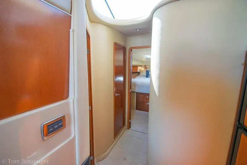 Slide: The Image of Interior hallway of 2005 Sea Ray 420 Sedan Bridge yacht, featuring wood accents and modern design. - 20
