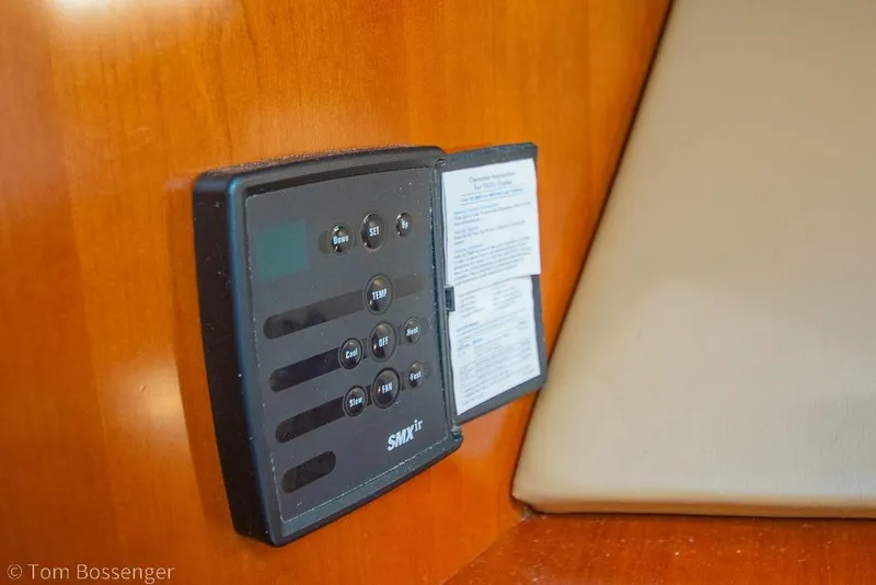 Slide: The Image of Control panel on 2005 Sea Ray 420 Sedan Bridge yacht interior. - 24