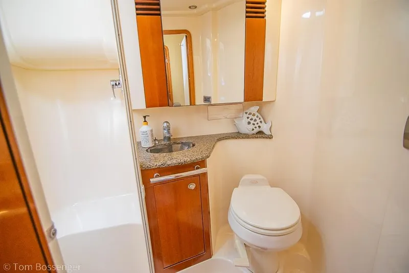 Slide: The Image of Luxurious bathroom in 2005 Sea Ray 420 Sedan Bridge yacht with granite countertop. - 28