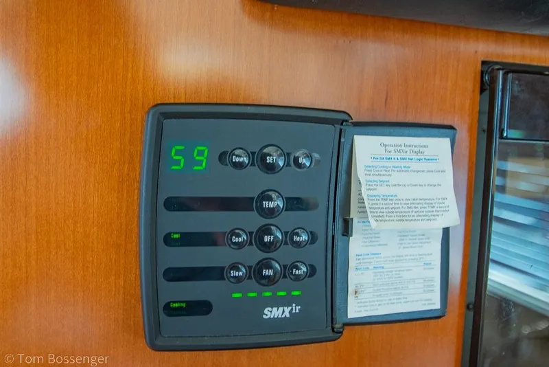 Slide: The Image of SMXir control panel on 2005 Sea Ray 420 Sedan Bridge yacht interior. - 31