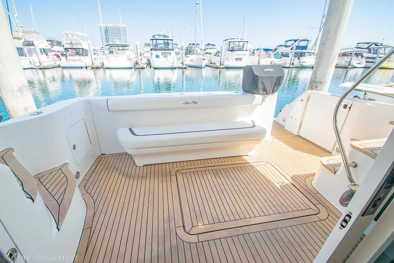 Slide: The Image of 2005 Sea Ray 420 Sedan Bridge yacht deck with marina view. - 33