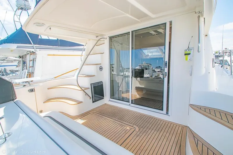 Slide: The Image of 2005 Sea Ray 420 Sedan Bridge yacht with teak deck and sliding glass door. - 34