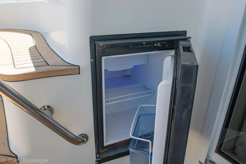 Slide: The Image of Open mini fridge on 2005 Sea Ray 420 Sedan Bridge yacht deck. - 41