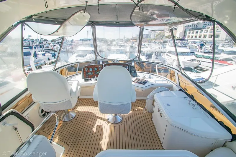 Slide: The Image of Interior view of 2005 Sea Ray 420 Sedan Bridge yacht cockpit at marina. - 42