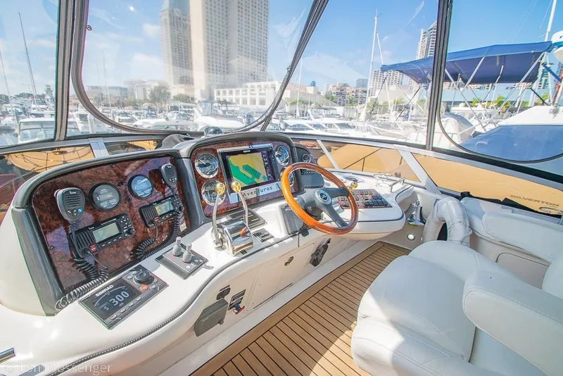 Slide: The Image of Luxurious 2005 Sea Ray 420 Sedan Bridge yacht cockpit with advanced navigation controls. - 44