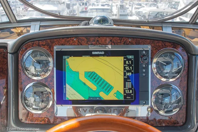 Slide: The Image of Dashboard of 2005 Sea Ray 420 Sedan Bridge with navigation display and gauges. - 47