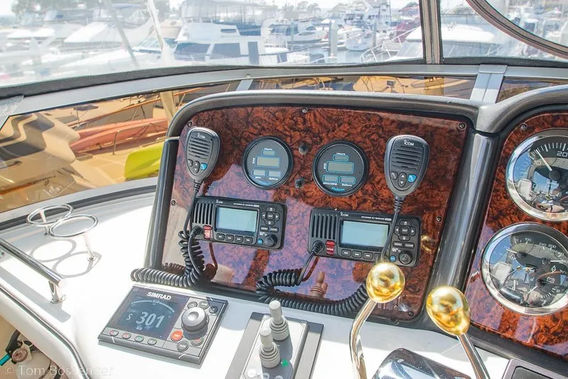 Slide: The Image of Control panel of a 2005 Sea Ray 420 Sedan Bridge yacht with navigation instruments. - 48