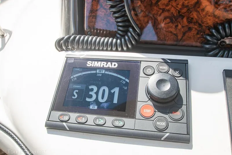 Slide: The Image of Simrad navigation system on 2005 Sea Ray 420 Sedan Bridge yacht dashboard. - 49