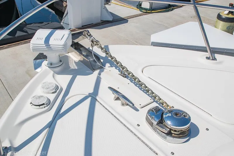 Slide: The Image of Bow deck of 2005 Sea Ray 420 Sedan Bridge with anchor chain and winch. - 55