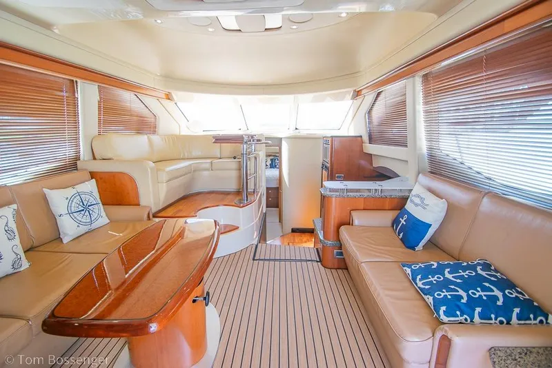 Slide: The Image of Luxurious interior of 2005 Sea Ray 420 Sedan Bridge yacht with elegant seating and decor. - 6