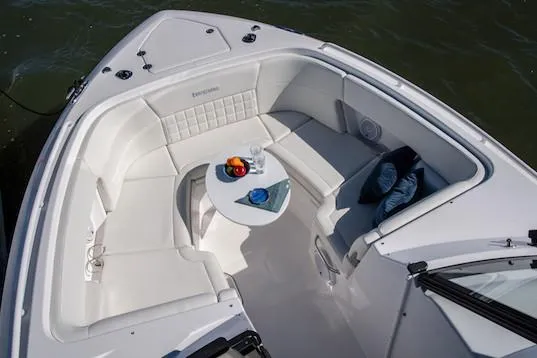 Slide: The Image of Manufacturer Provided Image: 2019 Everglades 340 Dual Console boat with white seating and small table. - 10