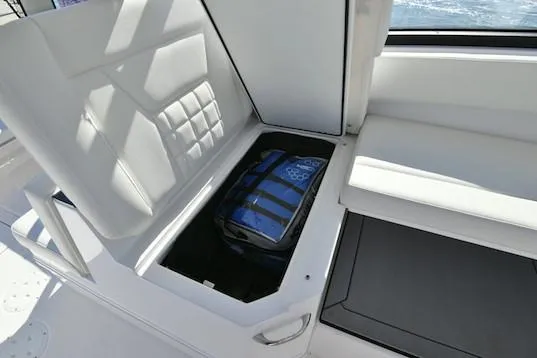 Slide: The Image of Manufacturer Provided Image: 2019 Everglades 340 Dual Console boat with under-seat storage compartment. - 15
