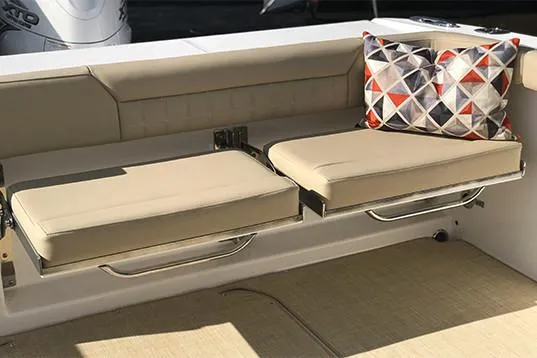 Slide: The Image of Manufacturer Provided Image: 2019 Everglades 340 Dual Console boat with beige seating and decorative pillows. - 18
