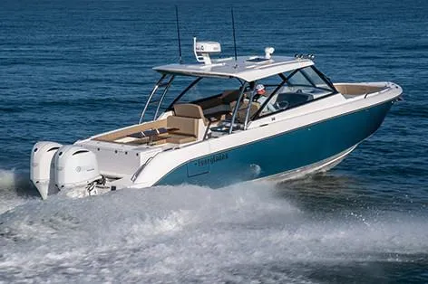 Slide: The Image of Manufacturer Provided Image: 2019 Everglades 340 Dual Console boat cruising on the ocean. - 6