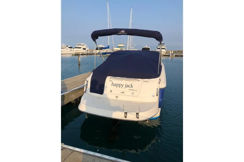 Slide: The Image of 2006 Monterey 250 Cruiser docked at marina, covered and ready for sailing. - 10