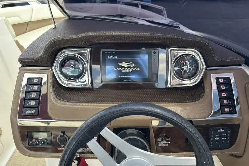 Slide: The Image of Dashboard of 2015 Chaparral 257 SSX boat with Garmin display and controls. - 10