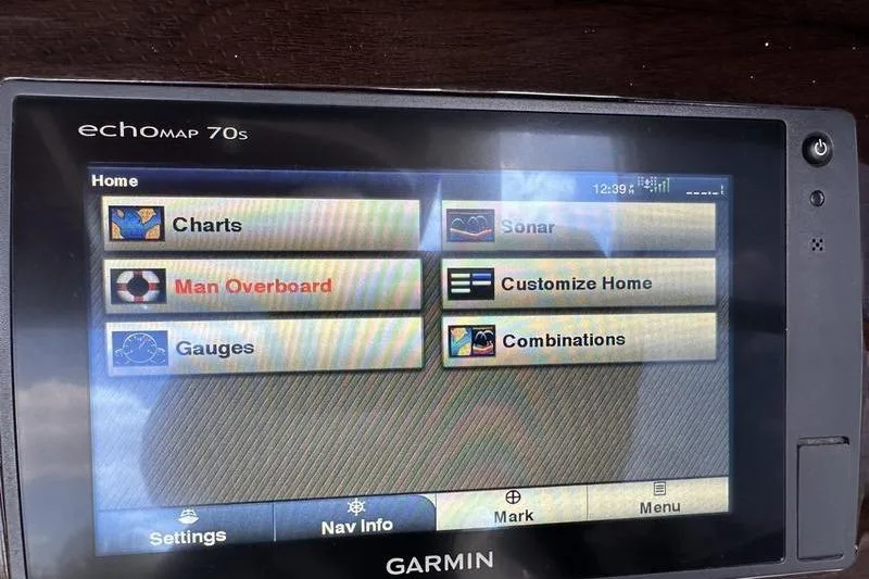 Slide: The Image of Garmin echoMAP 70s display on 2015 Chaparral 257 SSX, showing navigation and safety options. - 15
