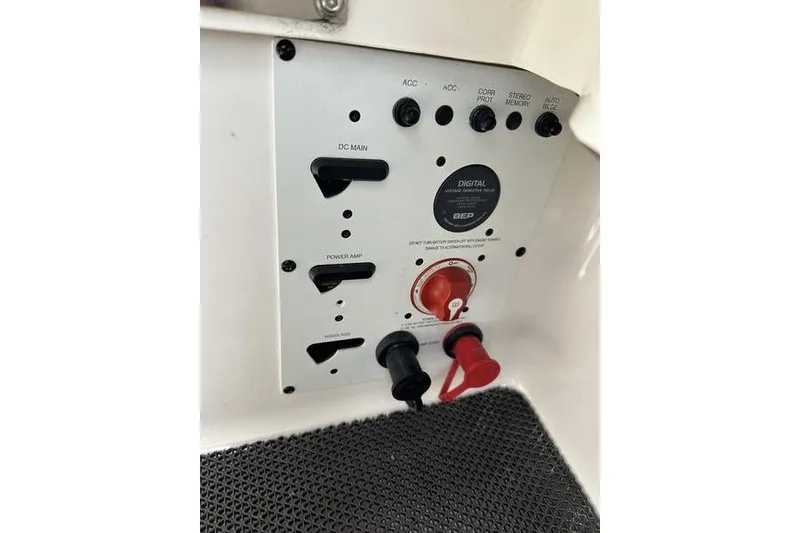 Slide: The Image of Control panel of a 2015 Chaparral 257 SSX boat with switches and connectors. - 23