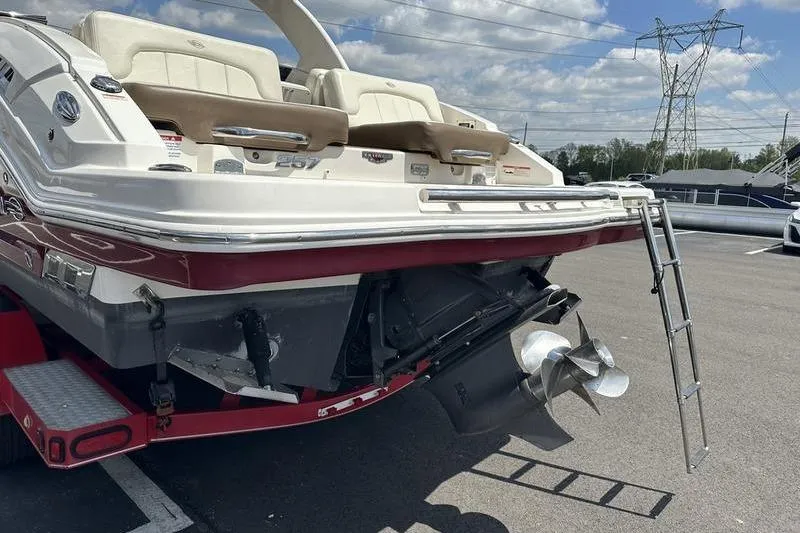 Slide: The Image of 2015 Chaparral 257 SSX boat rear view with ladder and propeller. - 26