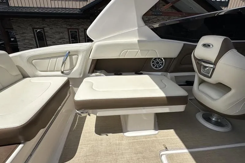 Slide: The Image of Interior of 2015 Chaparral 257 SSX boat with beige and brown seating. - 34
