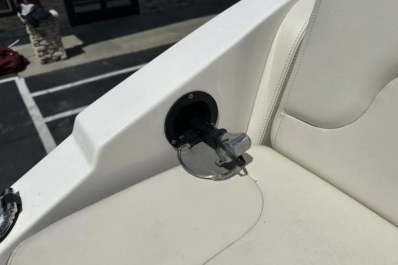 Slide: The Image of 2015 Chaparral 257 SSX boat interior detail with white upholstery and cup holder. - 36